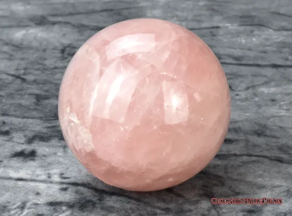 Hexenshop Dark Phönix Rosenquarz Halbedelsteinkugel Ø 8,5cm